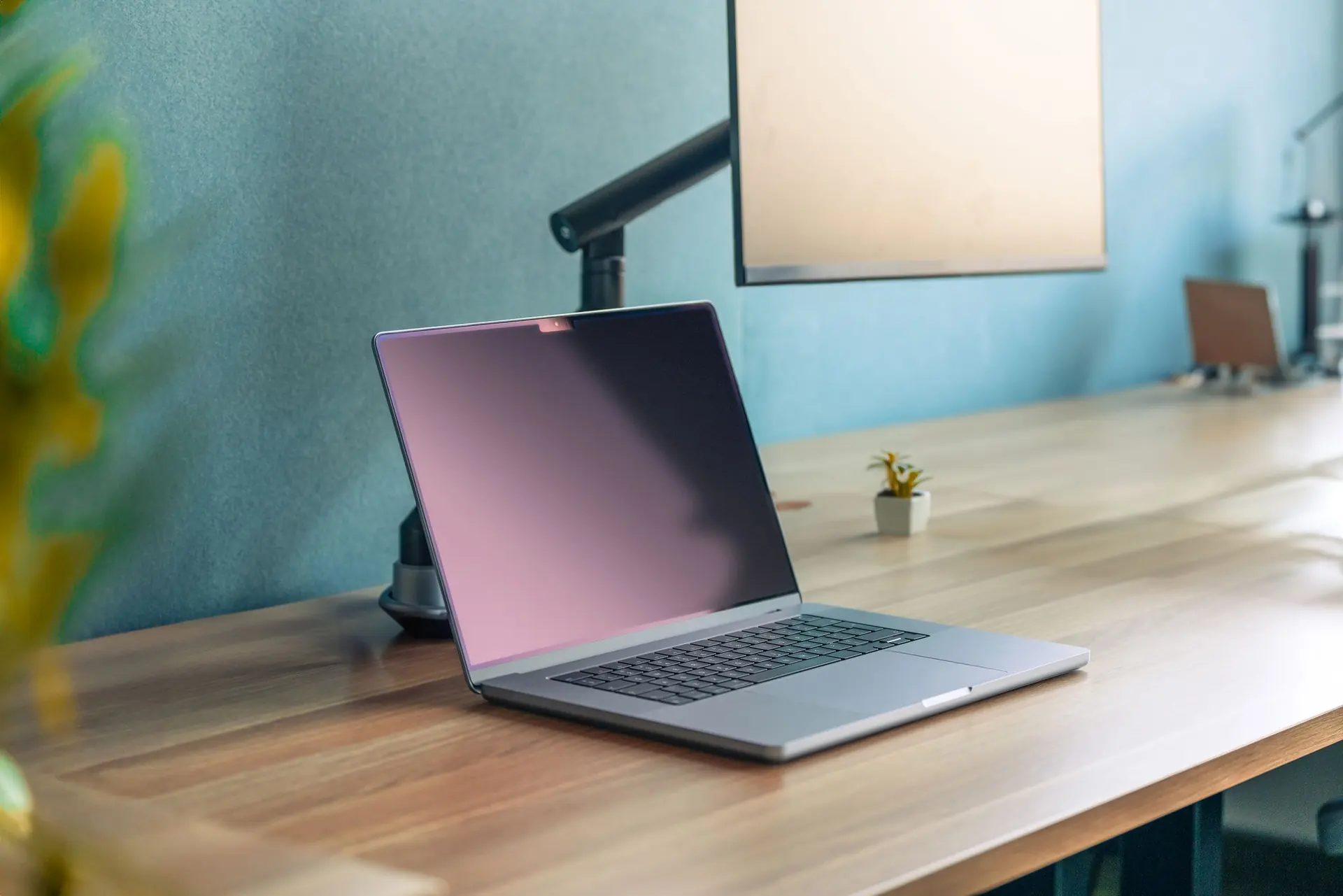 Laptop and monitor on a tidy office desk
